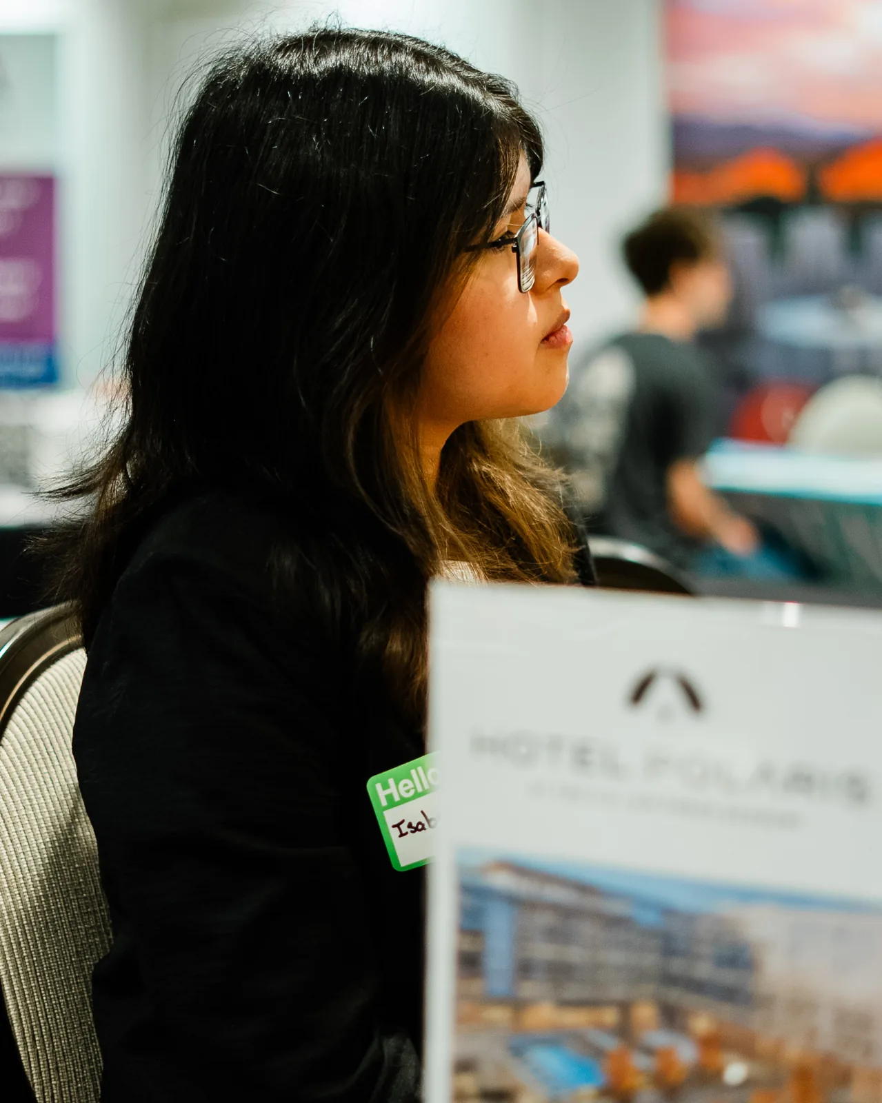 A student interviews with a representative at the Hotel Polaris table.